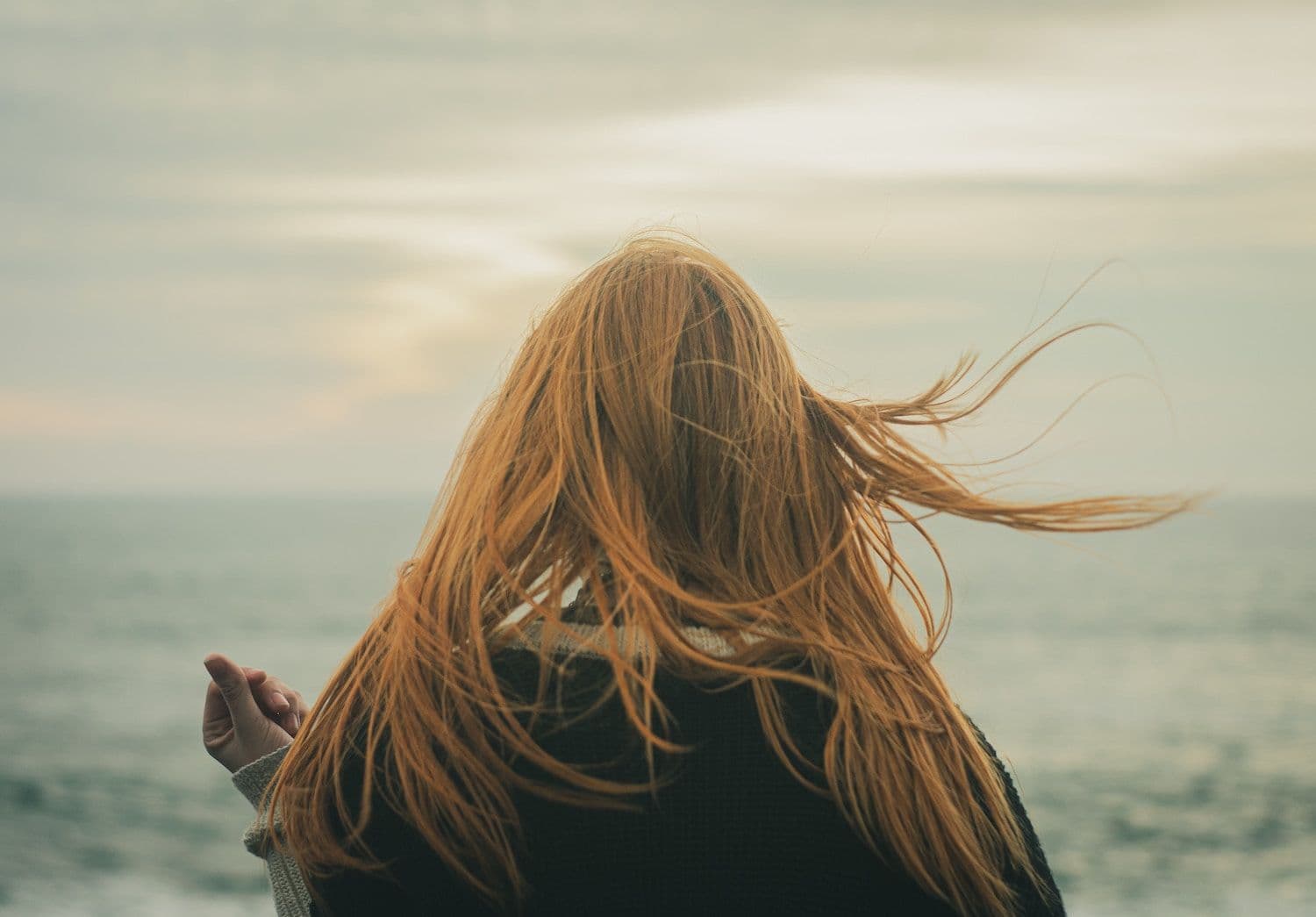 Person looking out across the sea. 