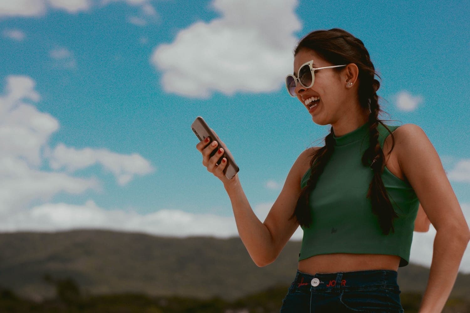 Person laughing at something on their phone.