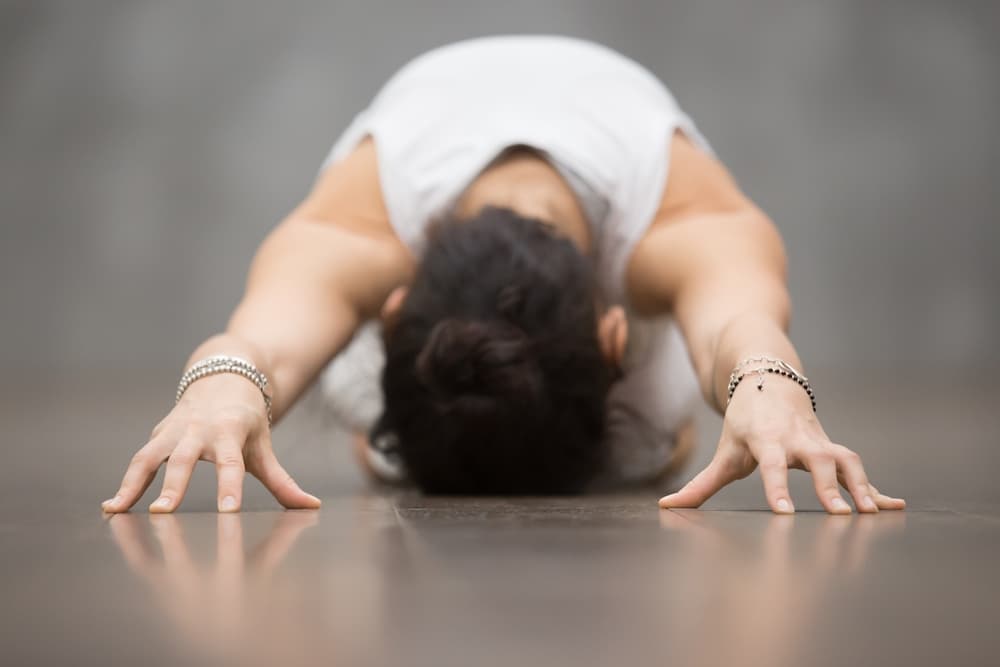 This is a photo of a lady doing the child pose