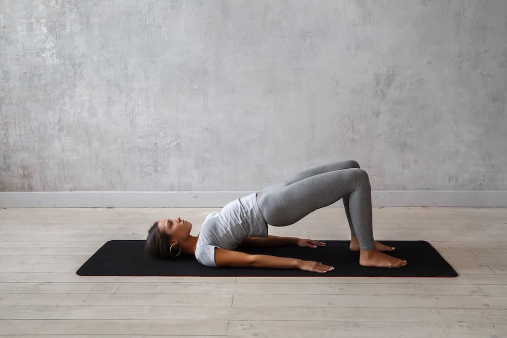 This is a photo of a lady doing the bridge pose