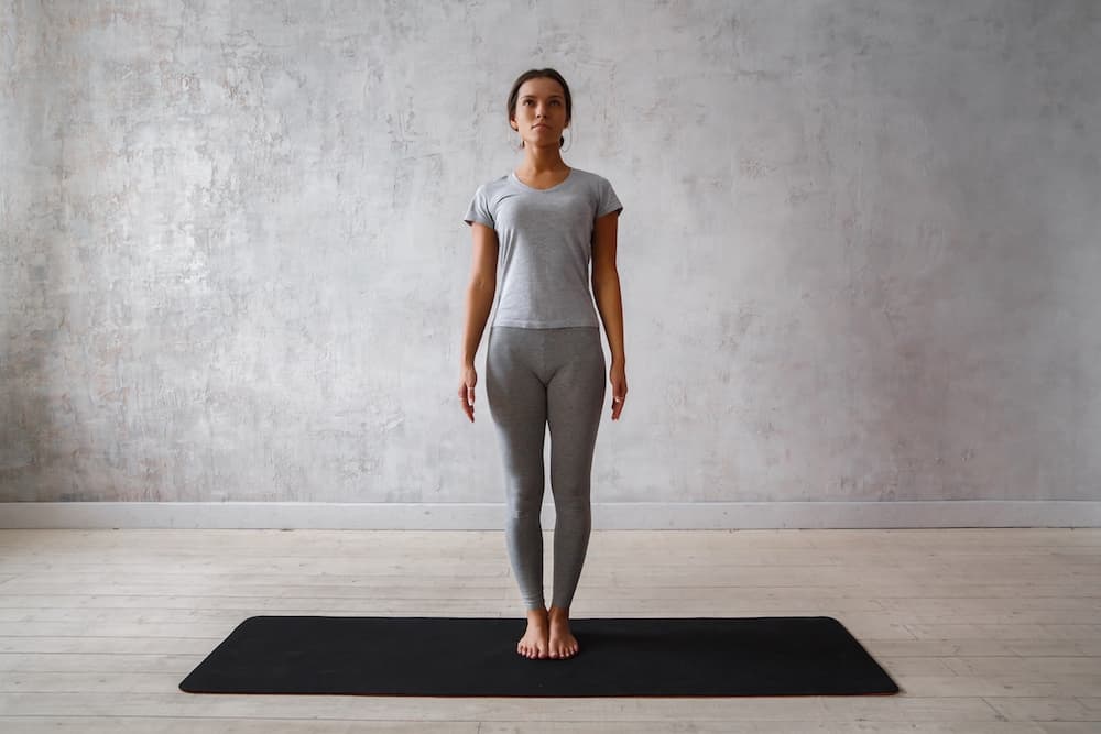 This is a photo of a lady doing the mountain pose