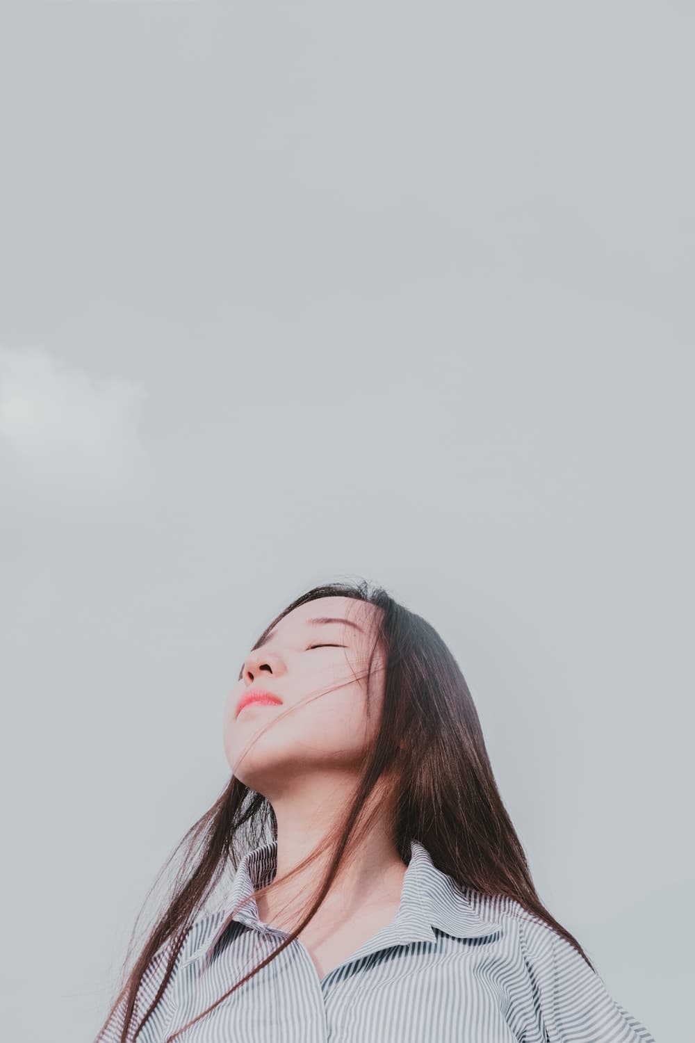 woman taking a deep breath