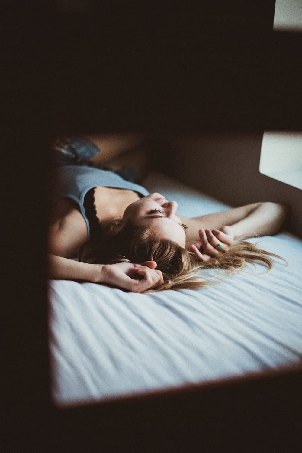 woman lying on bed