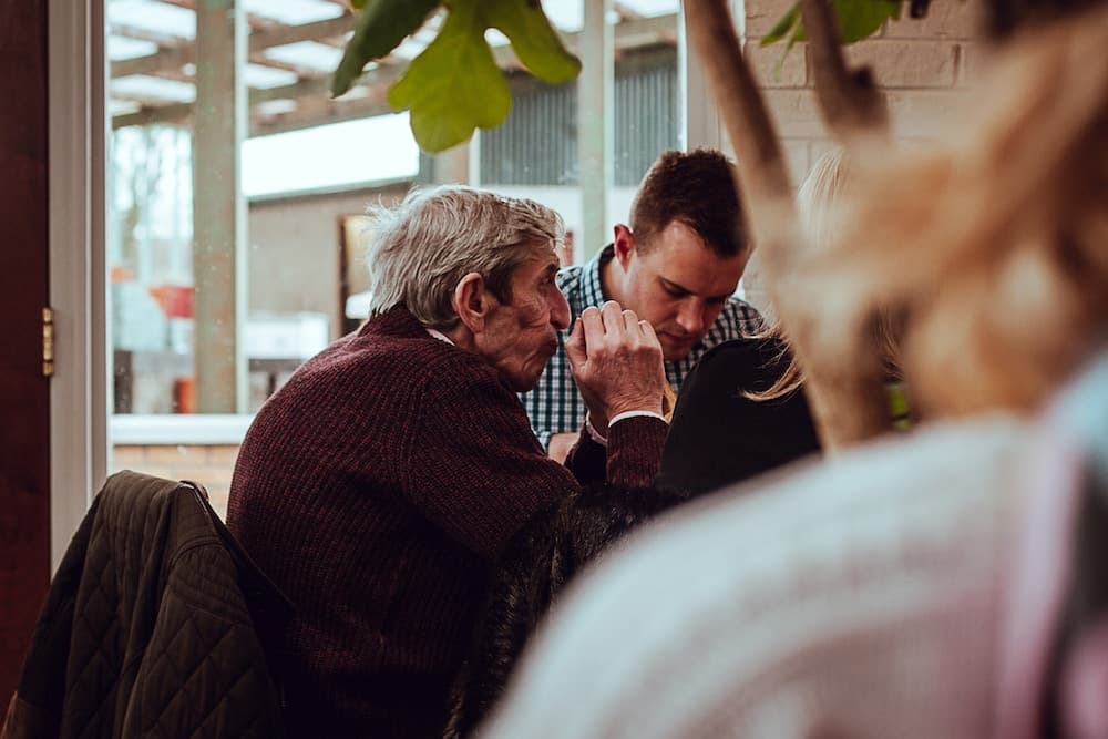 old man and young man talking