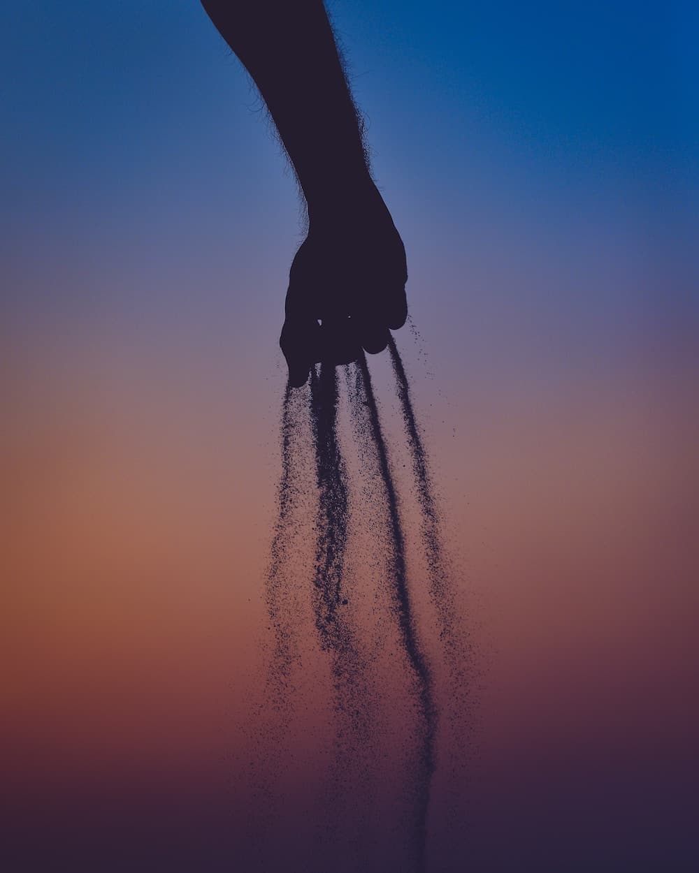 person holding sand