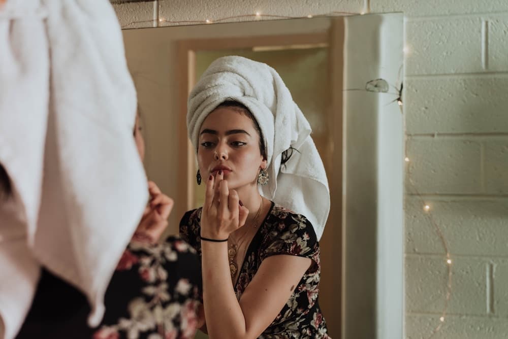 women checking makeup