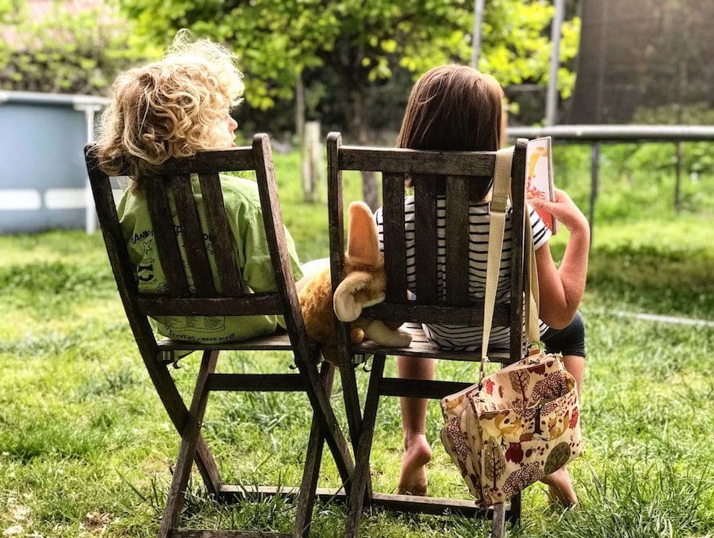children sat down reading