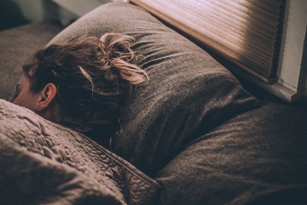 person asleep in bed
