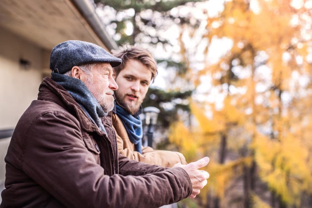a yound and old man talk together
