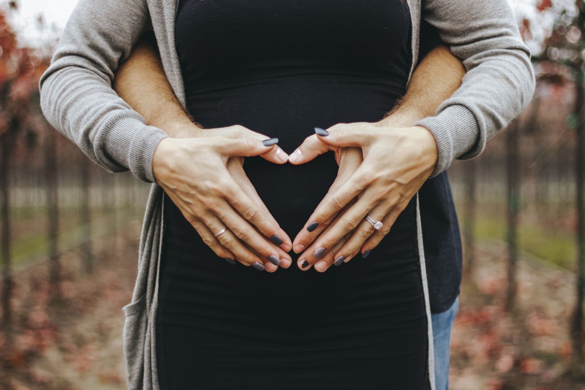 Man holding pregnant woman
