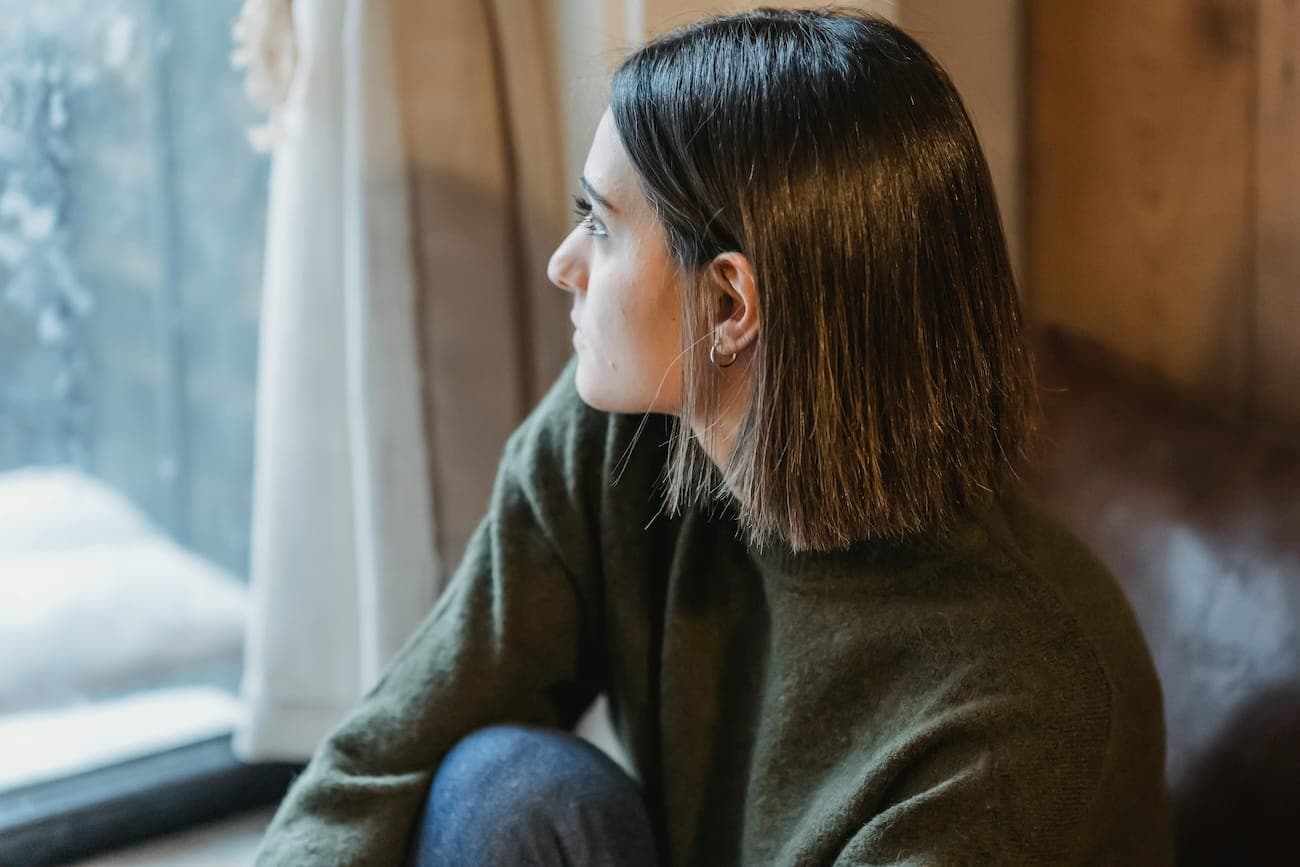 woman looking out of a window
